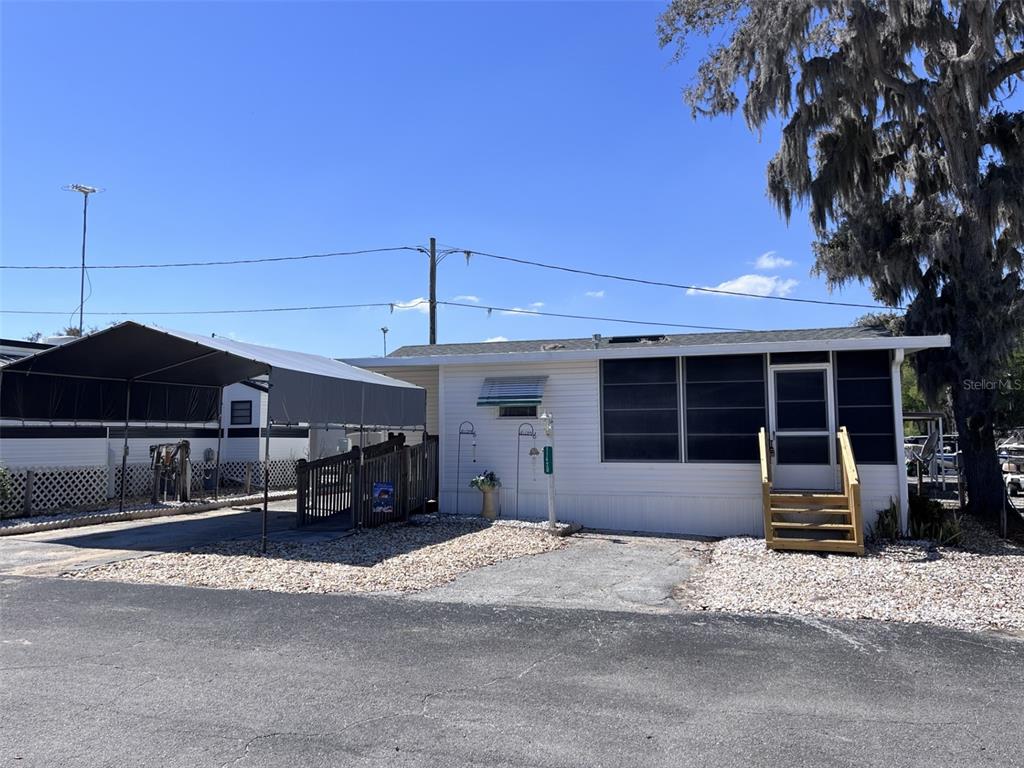 11420 Parakeet Circle Leesburg, FL 34788 - Photo 1 of 1 a front view of a house with a yard and garage