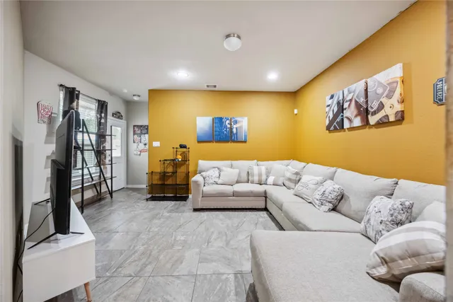 a living room with furniture and a couch