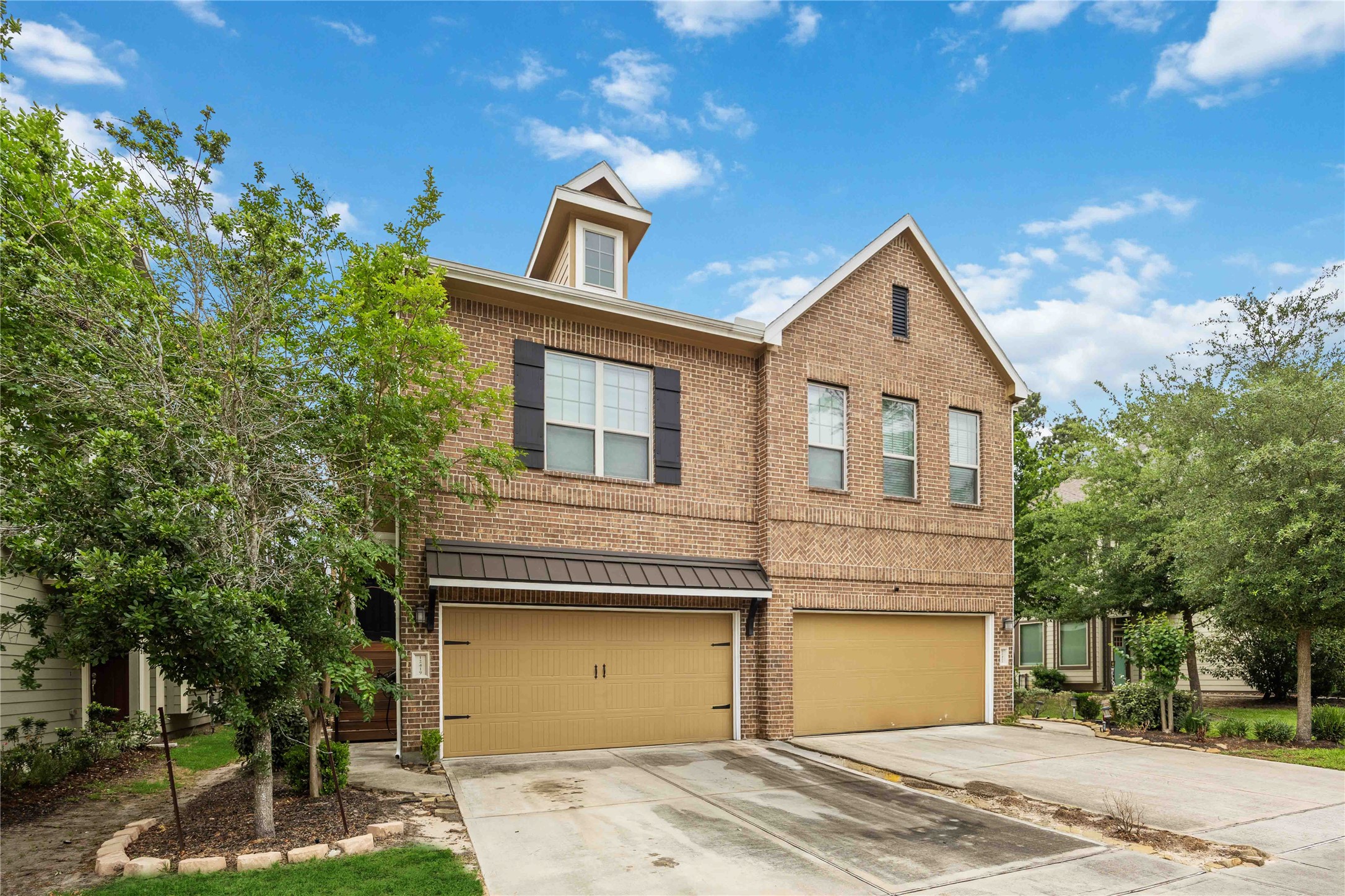 12419 Alora Bluff Trail Humble, TX 77346 - Photo 2 of 28 a view of a house with a yard and garage