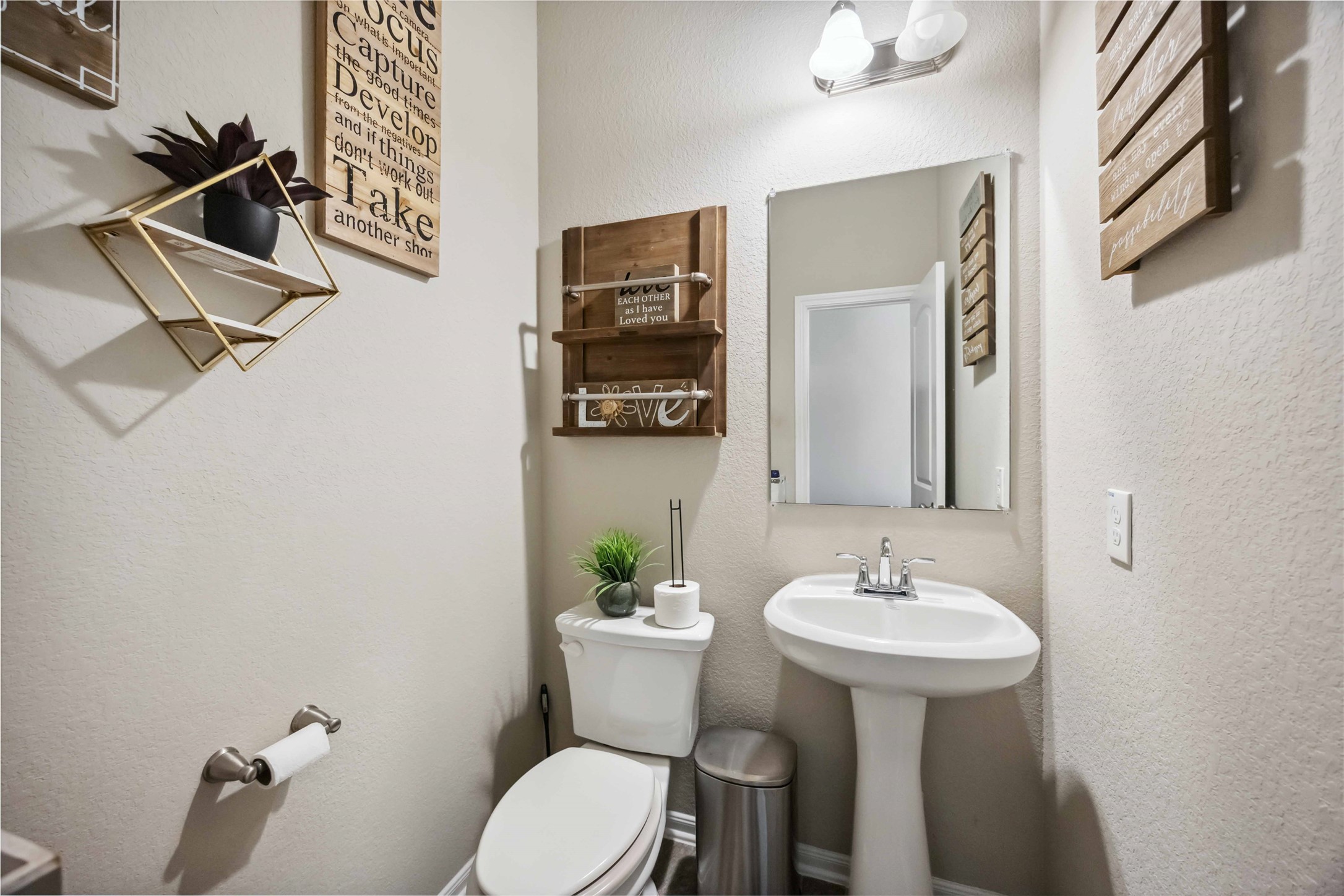 12419 Alora Bluff Trail Humble, TX 77346 - Photo 24 of 28 a bathroom with a sink mirror and toilet
