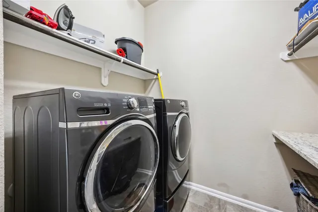 a utility room with dryer and washer