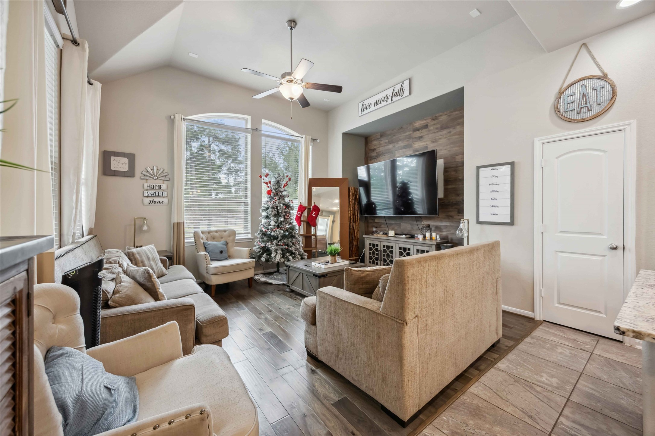 12419 Alora Bluff Trail Humble, TX 77346 - Photo 5 of 28 a living room with furniture and a flat screen tv