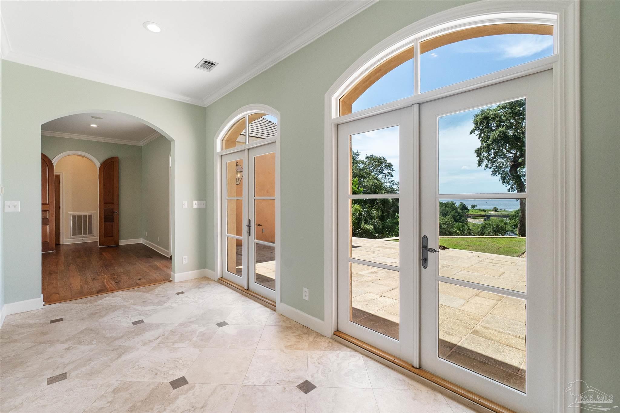 1725 E Lane Pensacola, FL 32501 - Photo 12 of 72 a view of a hallway with wooden floor and windows