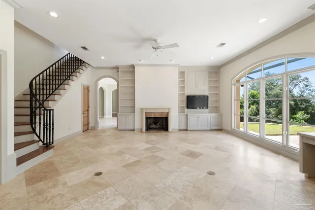 a kitchen with cabinets and window