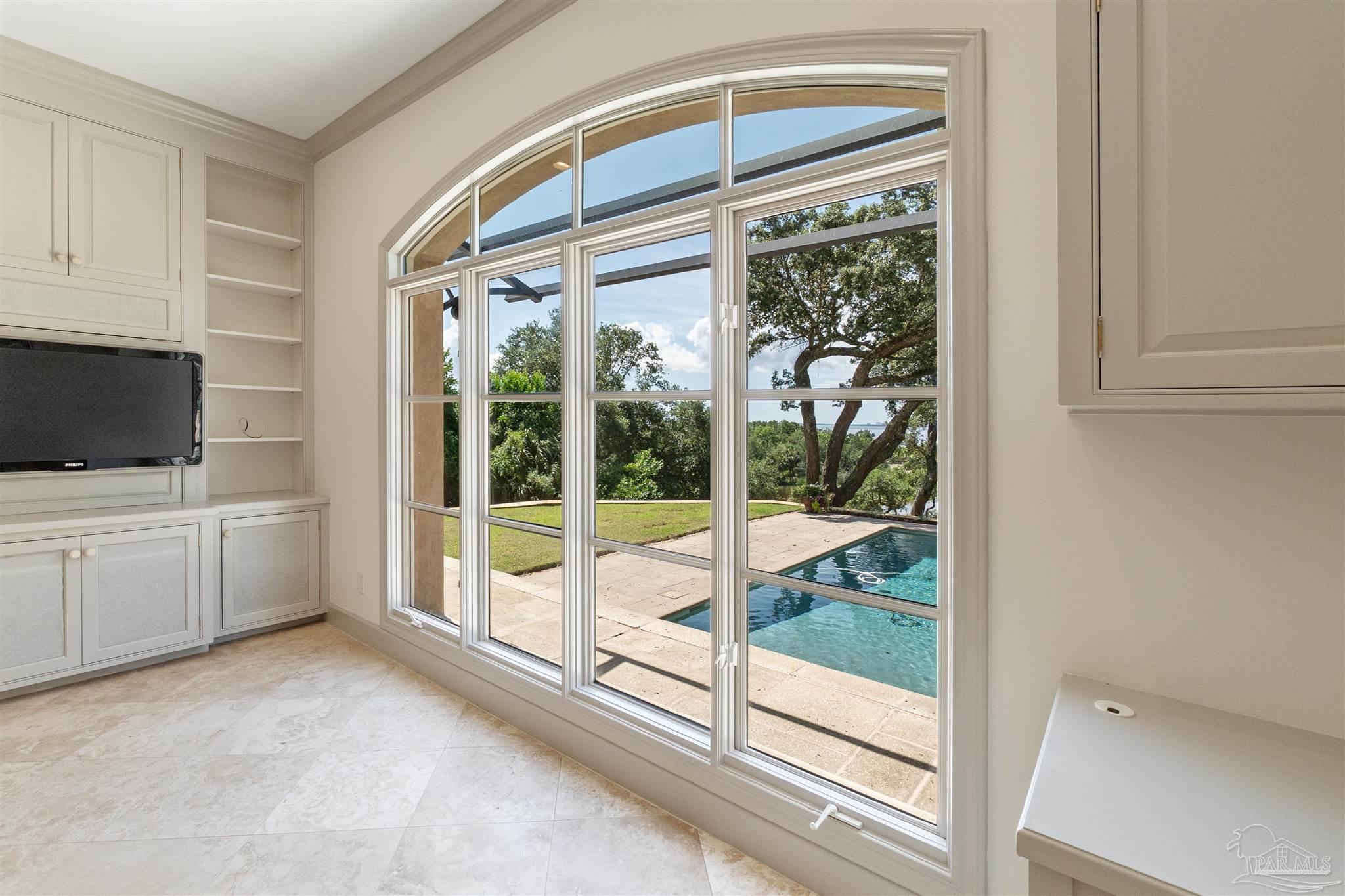 1725 E Lane Pensacola, FL 32501 - Photo 16 of 72 a view of a livingroom with an empty space and large windows