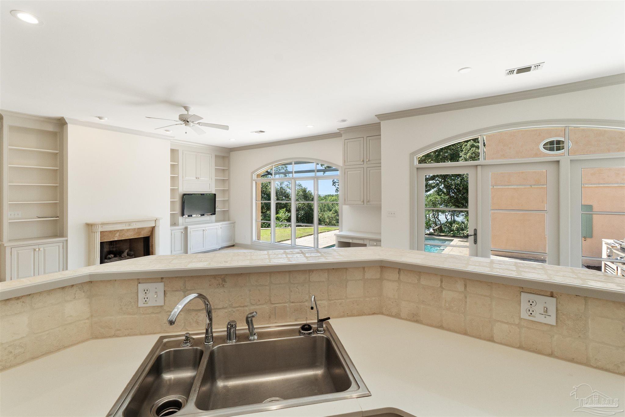 1725 E Lane Pensacola, FL 32501 - Photo 19 of 72 a bathroom with a sink and a large mirror