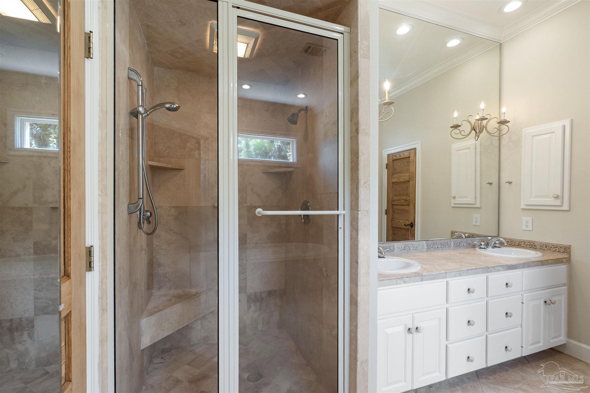 1725 E Lane Pensacola, FL 32501 - Photo 32 of 72 a bathroom with a shower sink and mirror