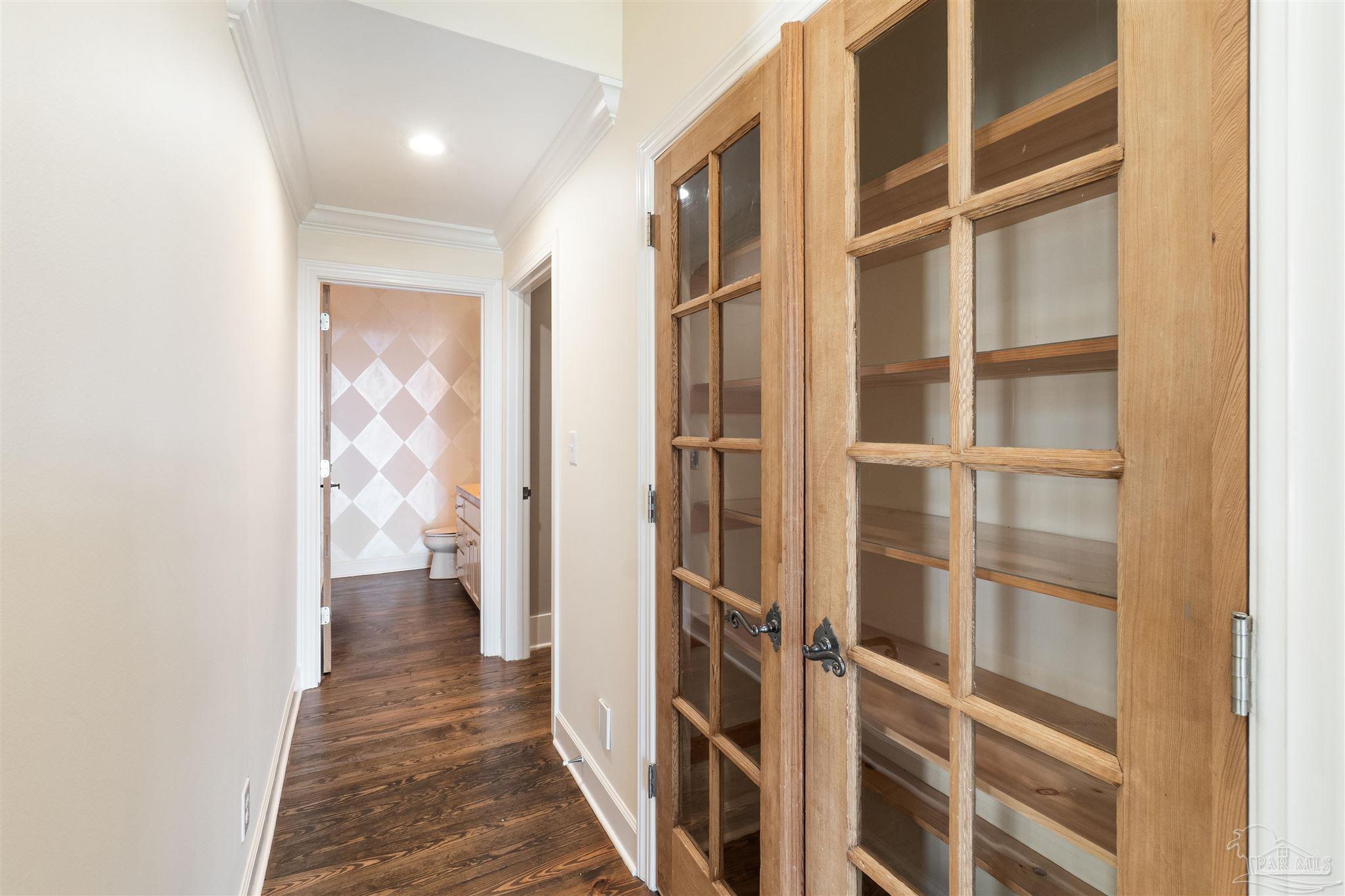 1725 E Lane Pensacola, FL 32501 - Photo 36 of 72 a view of a hallway with wooden floor and windows