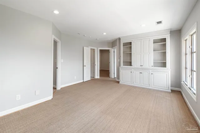 a utility room with cabinets washer and dryer