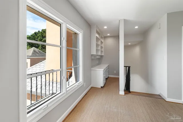 a view of bathroom with a sink and a mirror
