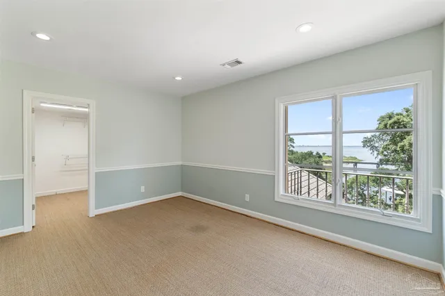 a house with swimming pool in front of it