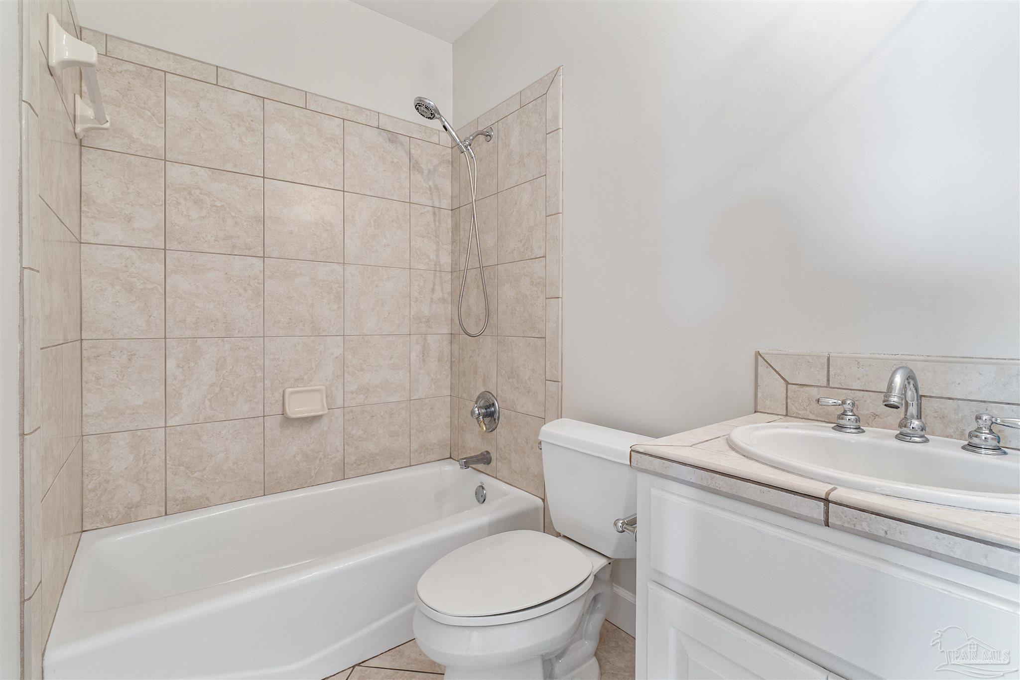 1725 E Lane Pensacola, FL 32501 - Photo 45 of 72 a bathroom with a sink toilet and shower