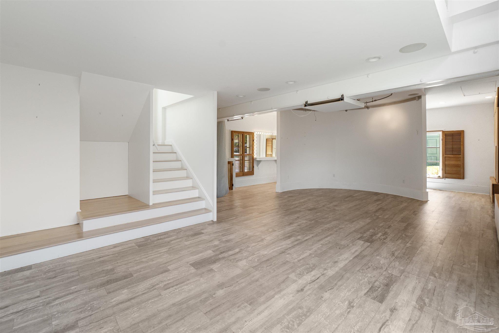 1725 E Lane Pensacola, FL 32501 - Photo 51 of 72 a view of a room with wooden floors and white walls