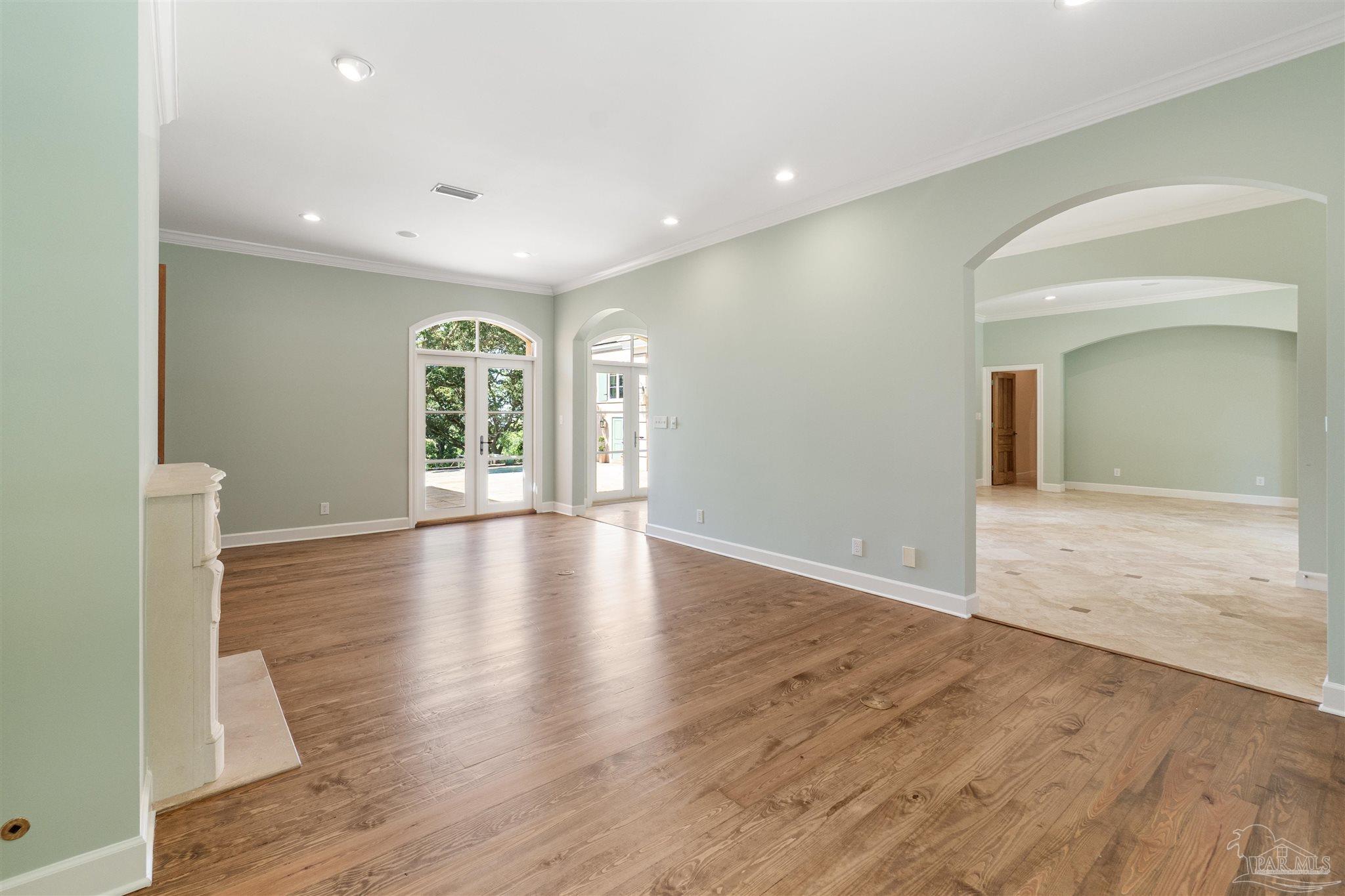 1725 E Lane Pensacola, FL 32501 - Photo 10 of 72 a view of an empty room with wooden floor and a window
