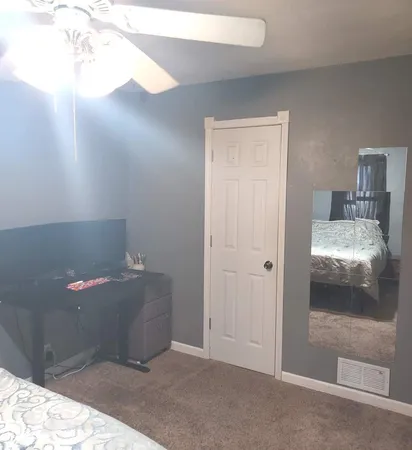 a view of a dining room with furniture and window