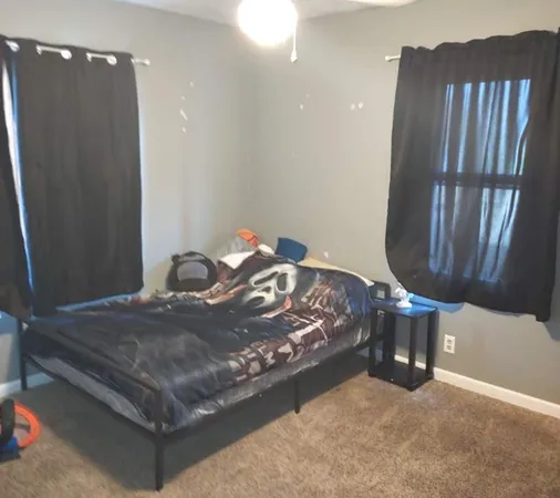 a room with furniture and mirror