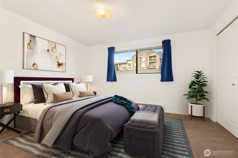 a bedroom with bed and a couch