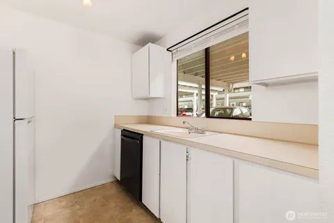 a kitchen with a sink and window