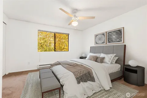 a bedroom with a bed and a window