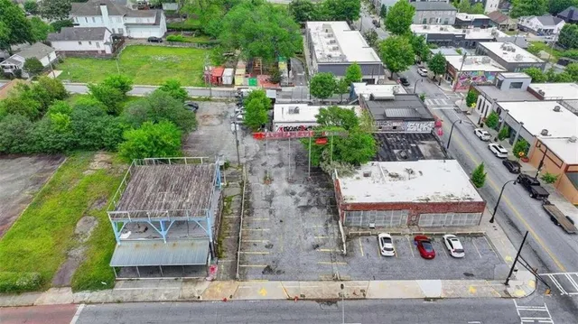 an aerial view of a house with outdoor space