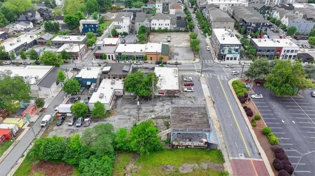 an aerial view of a house with a garden and swimming pool