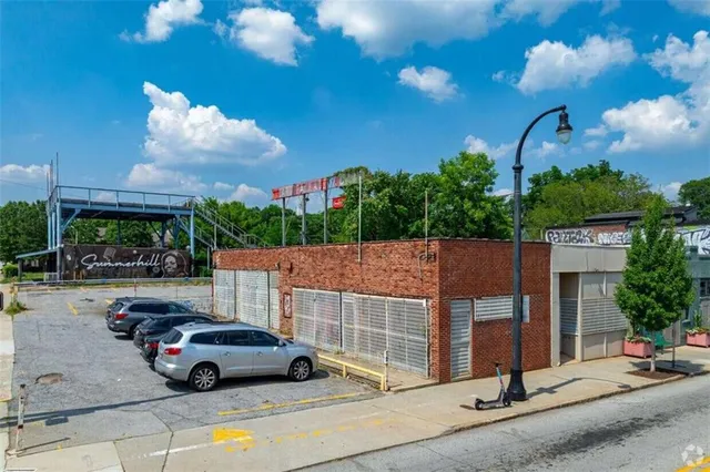 a view of street with parked cars