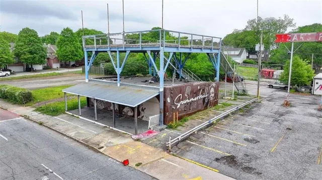 a house view with a sitting space and garden space