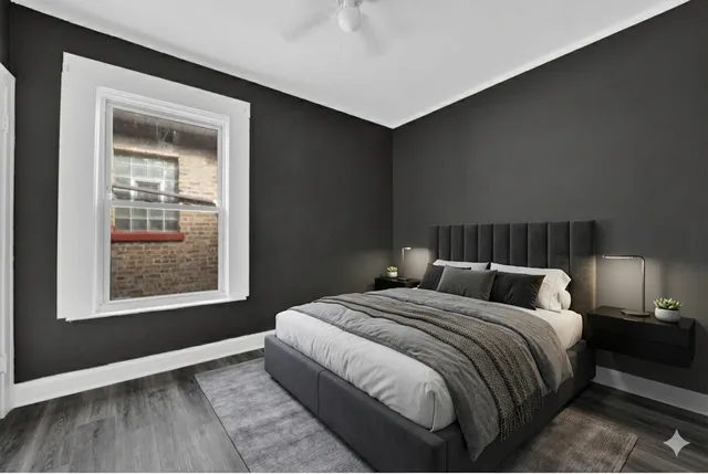 a bedroom with a bed and a window