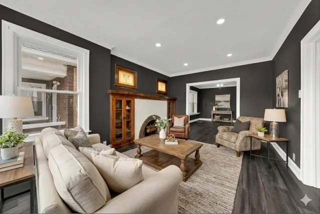 a living room with furniture and a fireplace