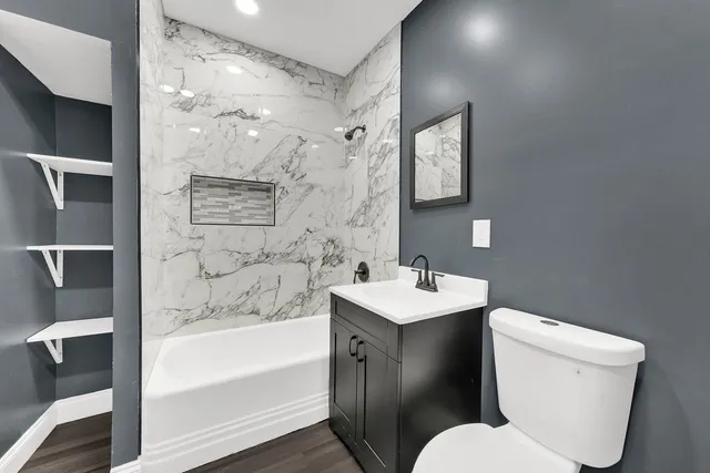 a bathroom with a toilet sink and bathtub