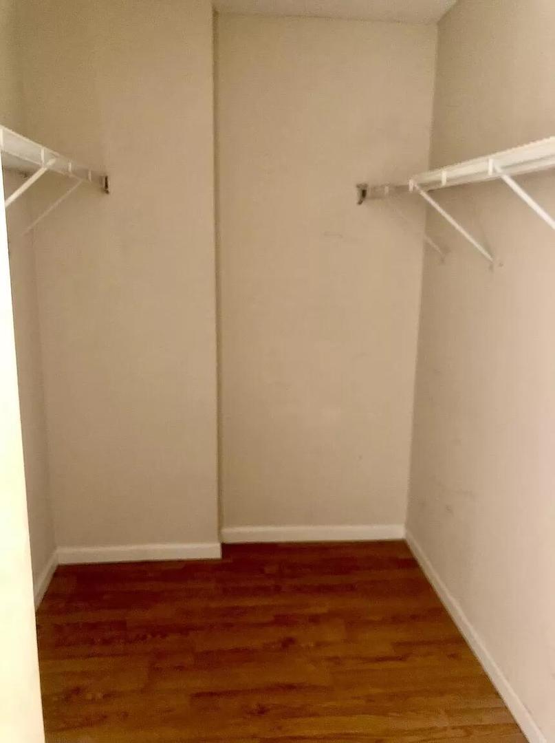 440 North Wabash Avenue, Unit 3703 Chicago, IL 60611 - Photo 6 of 27 a view of small space with wooden floor and a ceiling fan