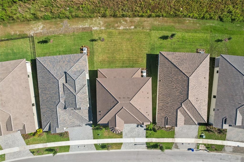 14930 Rider Pass Drive Lithia, FL 33547 - Photo 64 of 66 an aerial view of a house with outdoor space and lake view