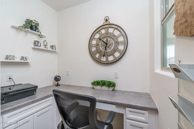 a table with a vase and a vase of flowers on it