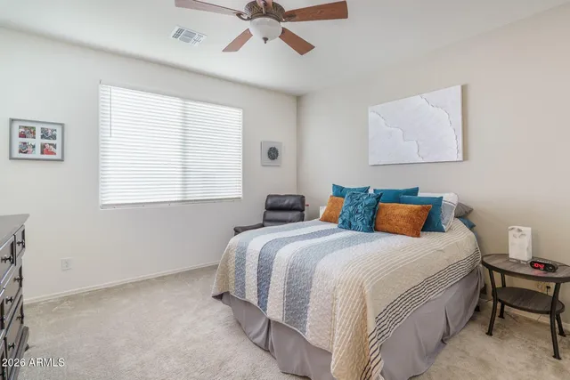 a bedroom with a bed and window