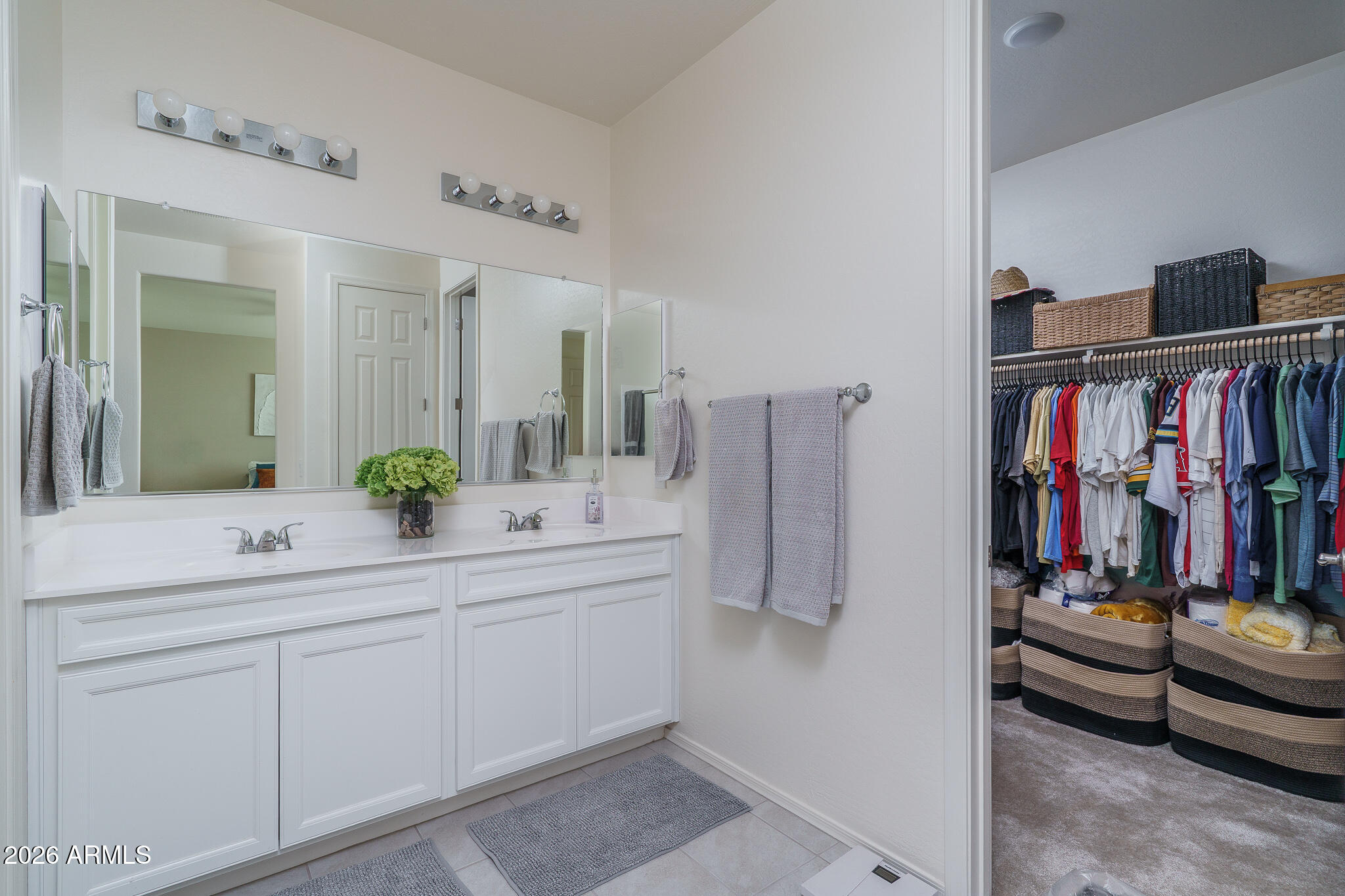 17851 West Red Fox Road Surprise, AZ 85387 - Photo 14 of 42 a view of walk in closet with clothes and shoes