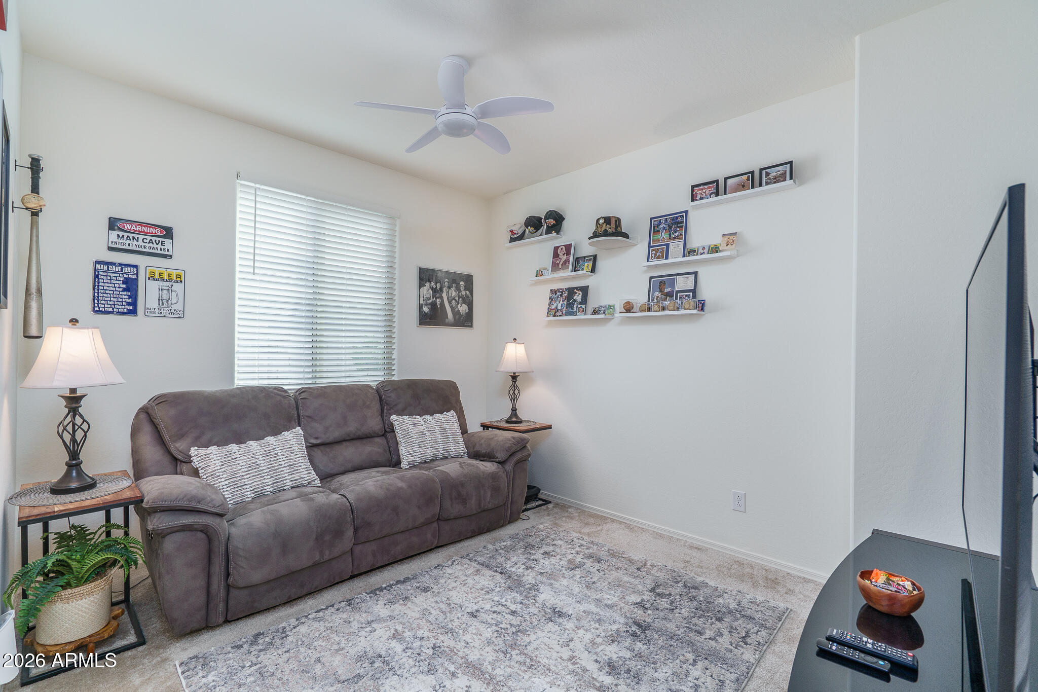17851 West Red Fox Road Surprise, AZ 85387 - Photo 16 of 42 a living room with furniture and a window