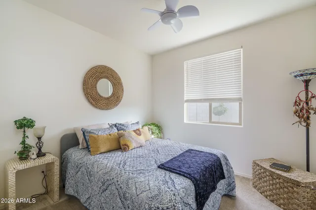 a bedroom with a bed and a window