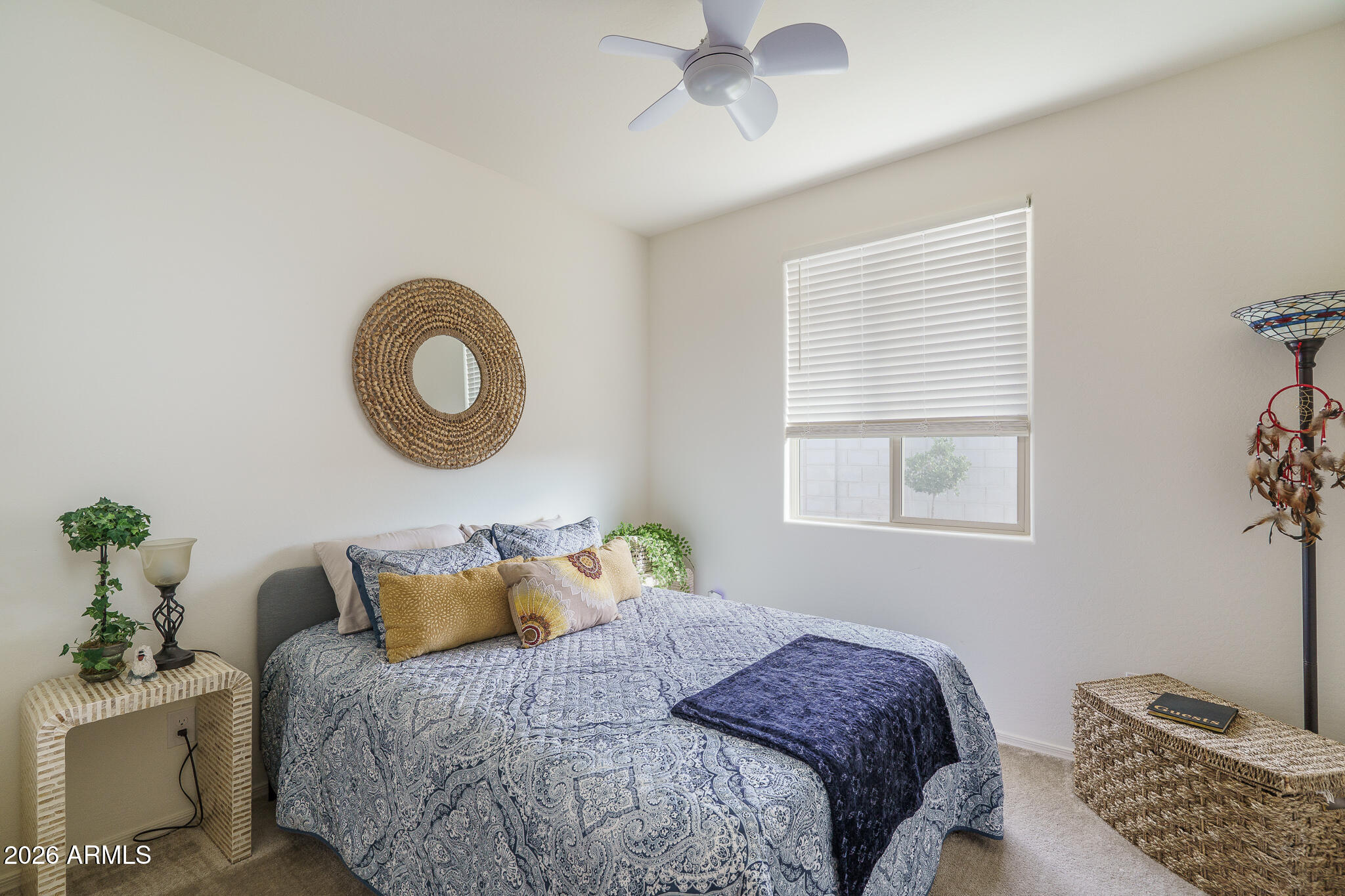 17851 West Red Fox Road Surprise, AZ 85387 - Photo 17 of 42 a bedroom with a bed and a window