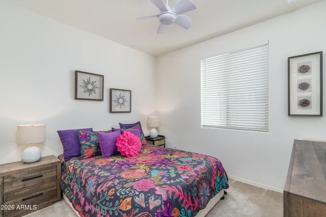 a bedroom with bed and window