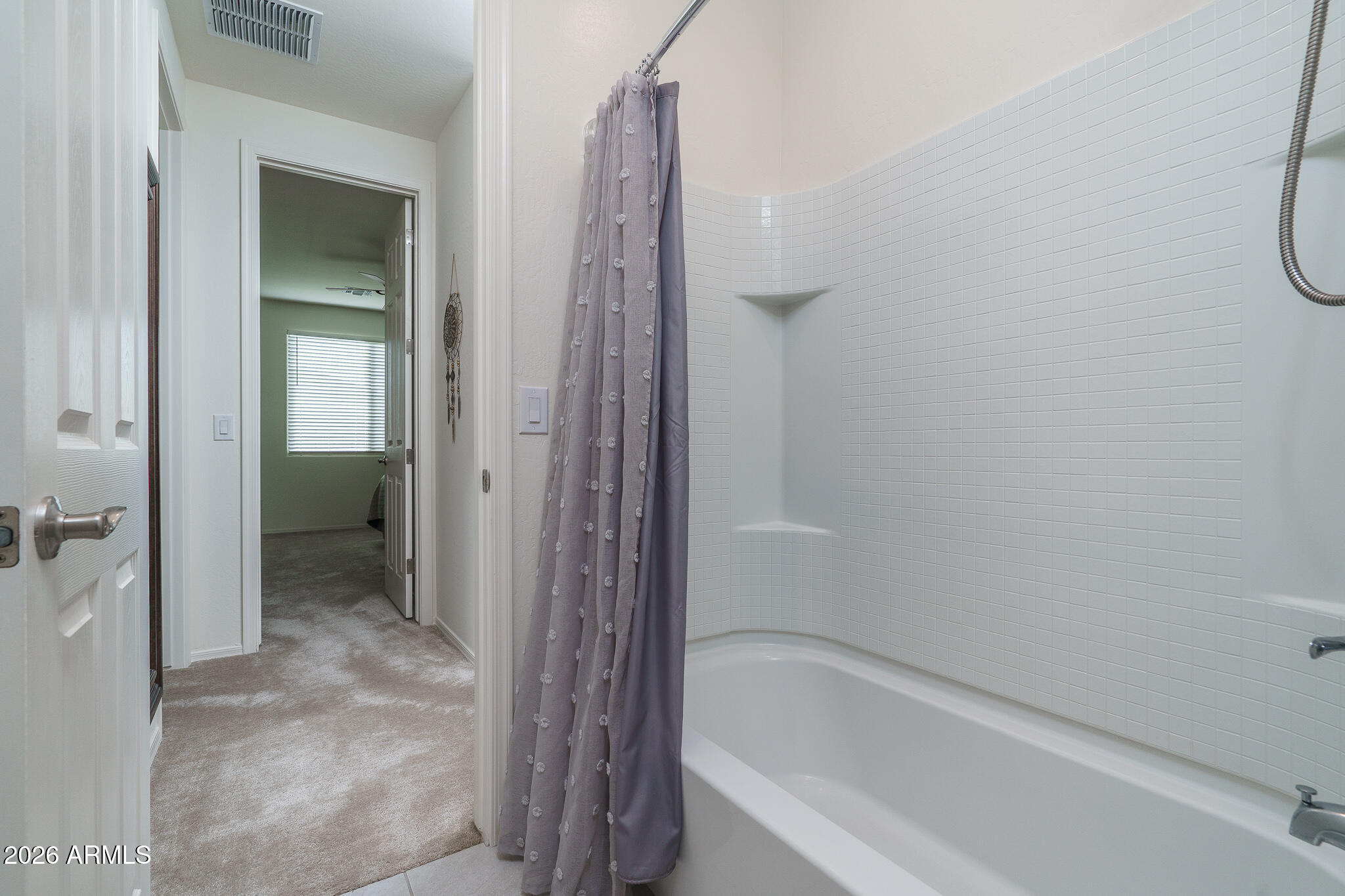 17851 West Red Fox Road Surprise, AZ 85387 - Photo 20 of 42 a bathroom with a bathtub
