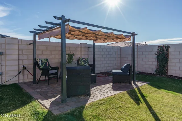 a patio with table and chairs