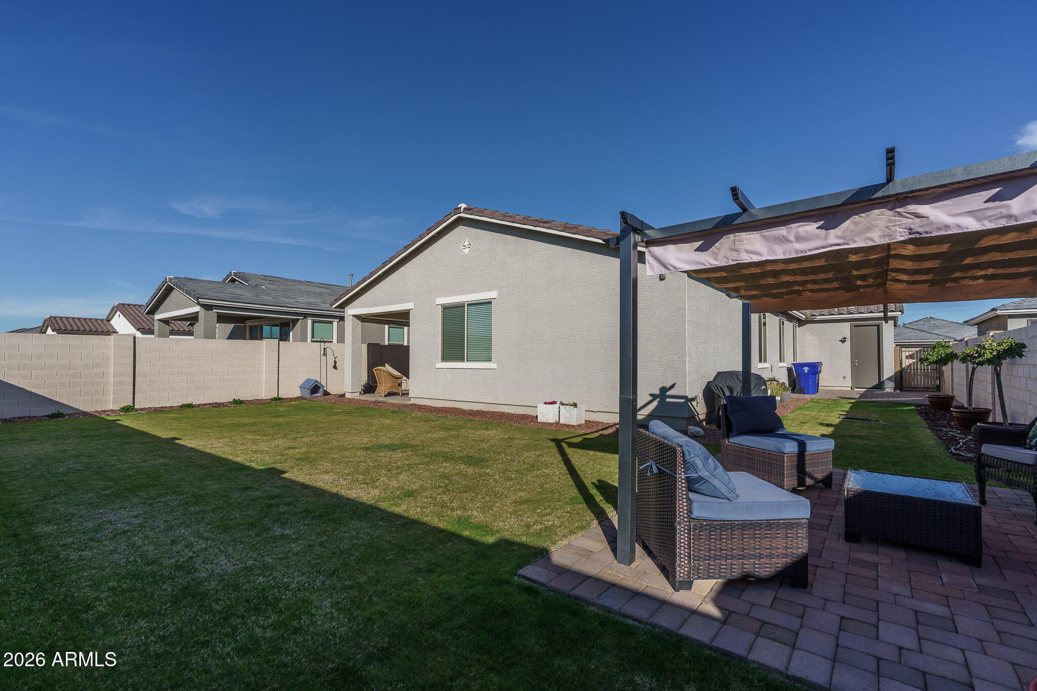 17851 West Red Fox Road Surprise, AZ 85387 - Photo 27 of 42 a view of a house with backyard and sitting area