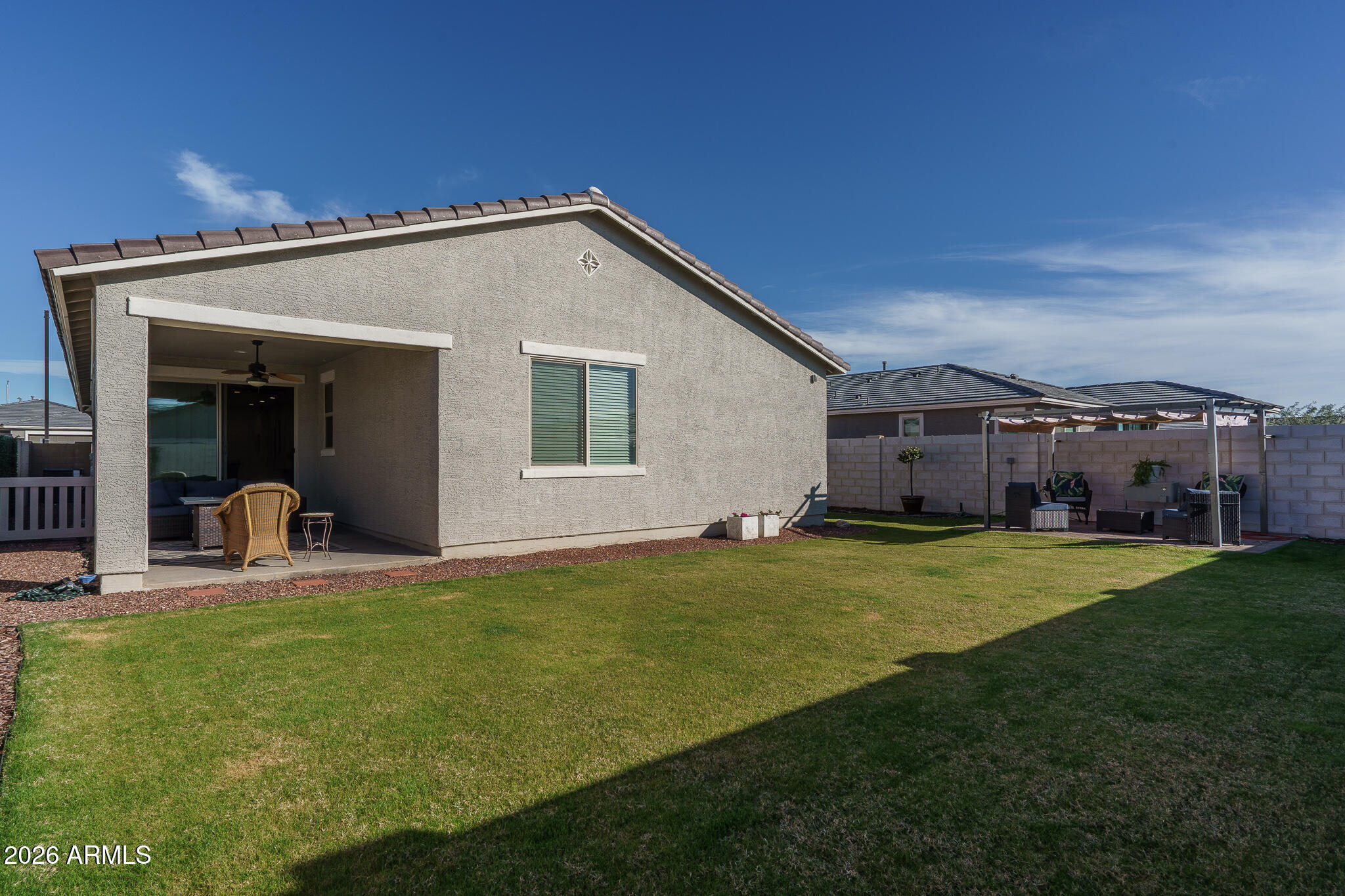 17851 West Red Fox Road Surprise, AZ 85387 - Photo 30 of 42 a view of a house with backyard and porch