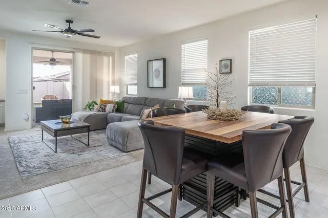 a view of a dining room with furniture and window