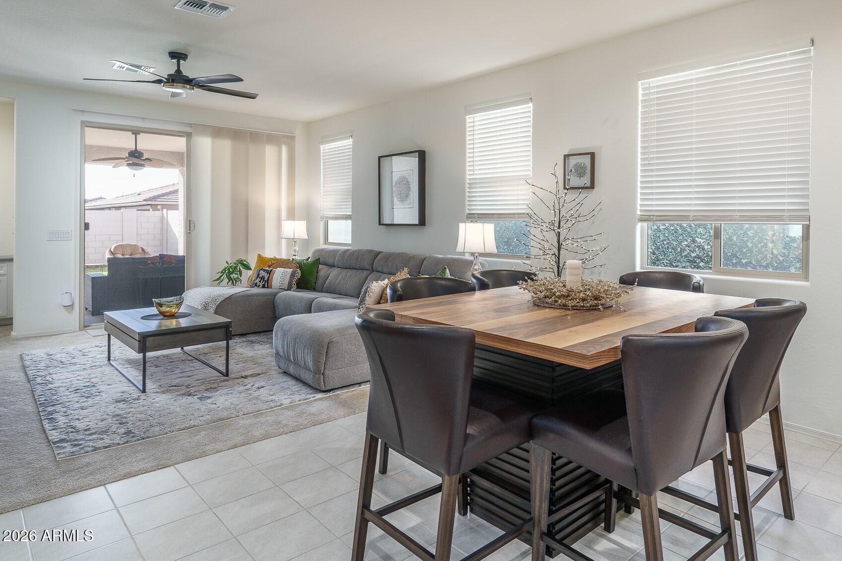 17851 West Red Fox Road Surprise, AZ 85387 - Photo 7 of 42 a view of a dining room with furniture and window
