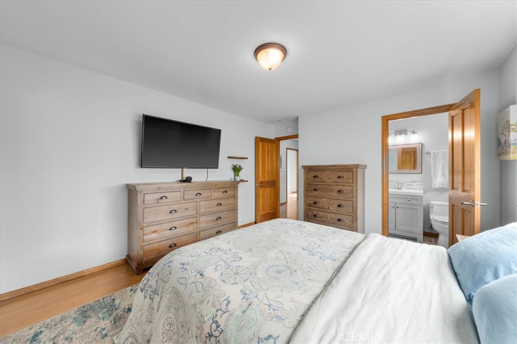 22643 Draille Drive Torrance, CA 90505 - Photo 15 of 33 a bedroom with a bed and a flat screen tv