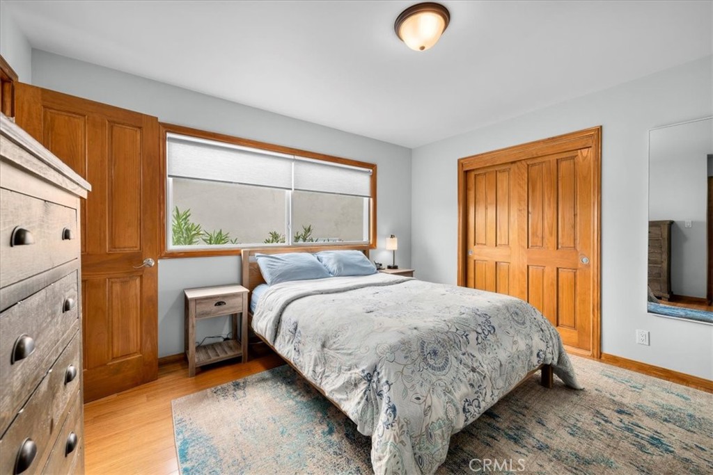 22643 Draille Drive Torrance, CA 90505 - Photo 17 of 33 a bedroom with a bed and a flat tv screen next to a window