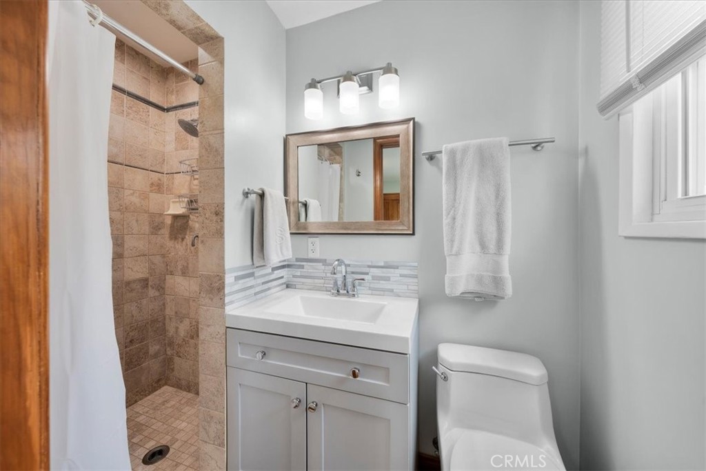 22643 Draille Drive Torrance, CA 90505 - Photo 18 of 33 a bathroom with a sink a toilet and shower