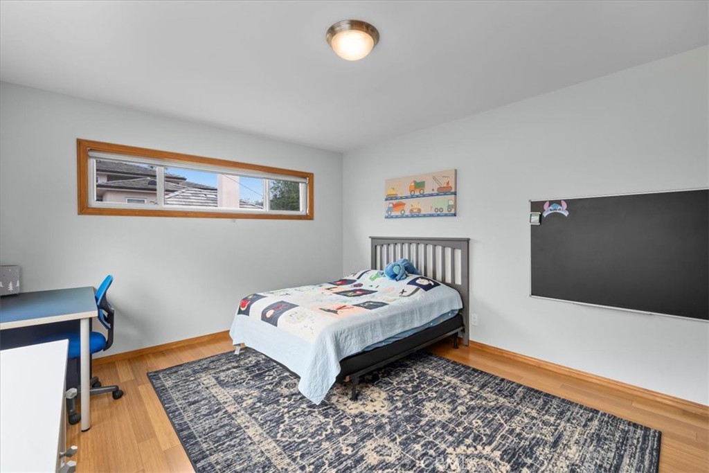 22643 Draille Drive Torrance, CA 90505 - Photo 19 of 33 a bedroom with bed and a rug