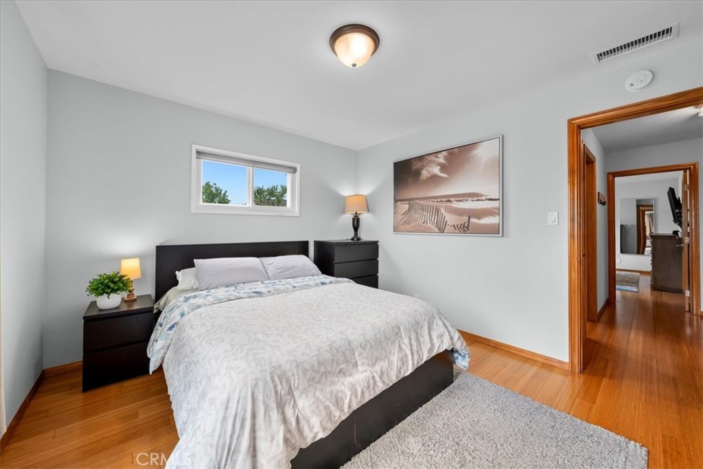22643 Draille Drive Torrance, CA 90505 - Photo 23 of 33 a bedroom with a bed and wooden floor